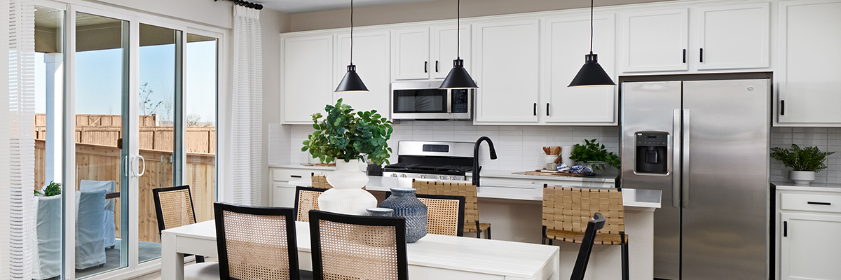 Inviting kitchen seen with natural light coming in from patio